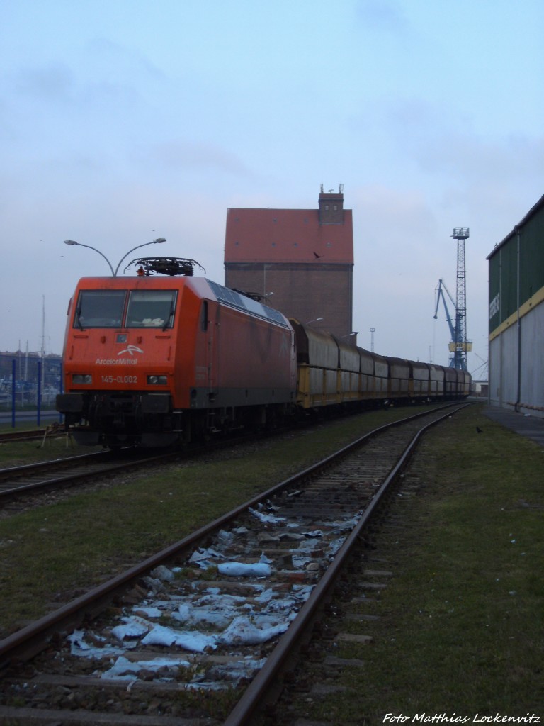 Arceolor 145-CL002 mit G�terwagen abgetsellt im Stralsunder Stadthafen (Bei der Getreide AG) am 12.10.13