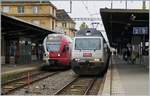 Die BLS Re 465  Kambly  mit ihrem passenden Zug und ein TPF Flirt in Neuchatel.